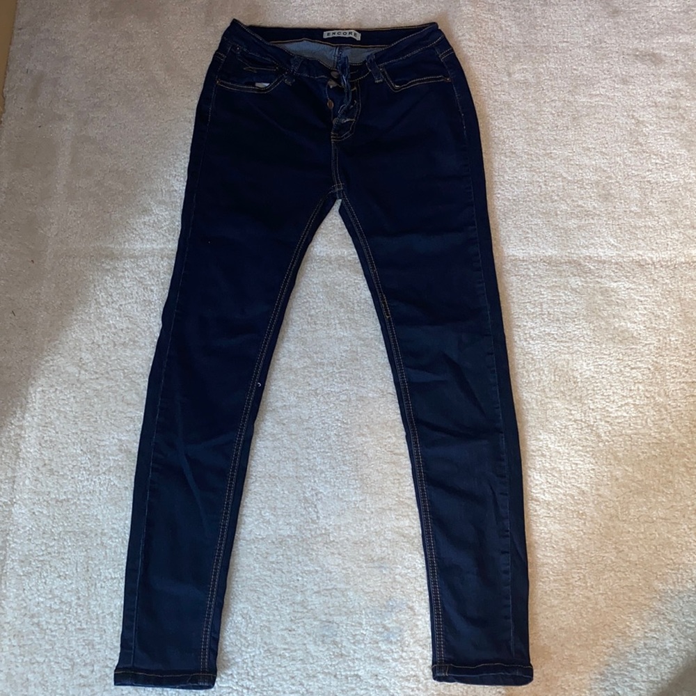 Encore dark wash skinny stretch jeans with brown stitch border.